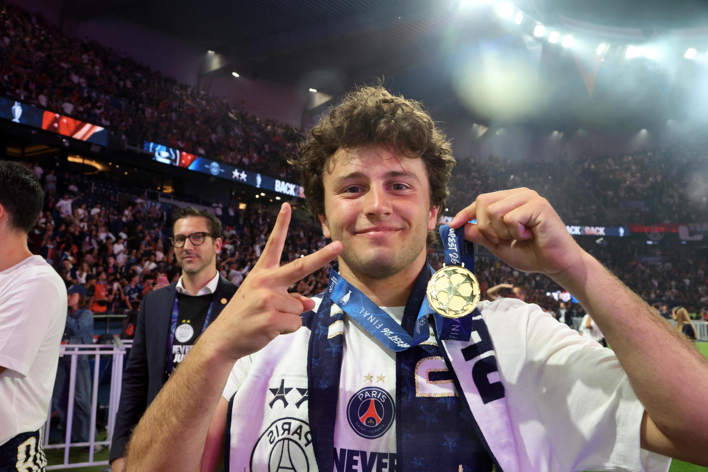 PARIS, FRANCE - MAY 31: Joao Neves of Paris Saint-Germain celebrate his medals during the 2026 Champions League Trophy presentation to the Paris Saint-Germain fans at Parc des Princes on May 31, 2026 in Paris, France. (Photo by Xavier Laine/Getty Images)