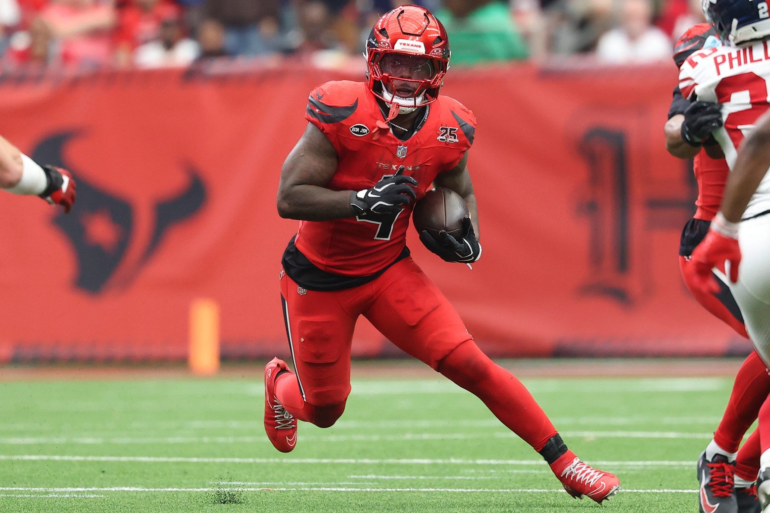 Oct 25, 2026; Houston, Texas, USA;  Houston Texans running back Woody Marks (4) runs with the ball during the third quarter against the New York Giants at Reliant Stadium.  Mandatory Credit: Troy Taormina-Imagn Images