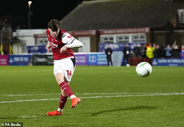 Fleetwood´s Conor Haughey slams home the decisive penalty in the shootout win over Arsenal (Nick Potts/PA)