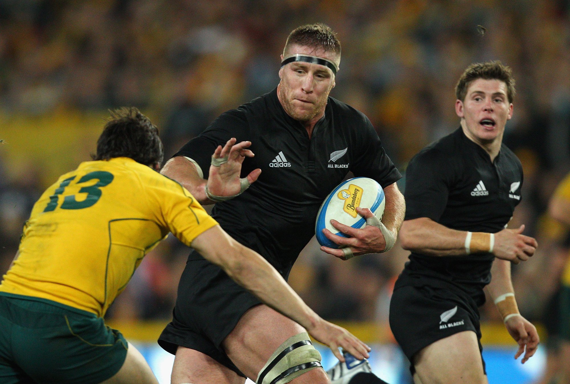 New Zealand's Brad Thorn hands off an Australian tackle during the September 2010 Tri-Nations clash