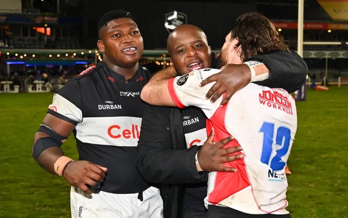 Mchunu brother Ntuthuko, left, Khuthazani during their days at the Cell C Sharks catch up with Lions' Marius Louw in 2023 before they all moved on to other unions. 