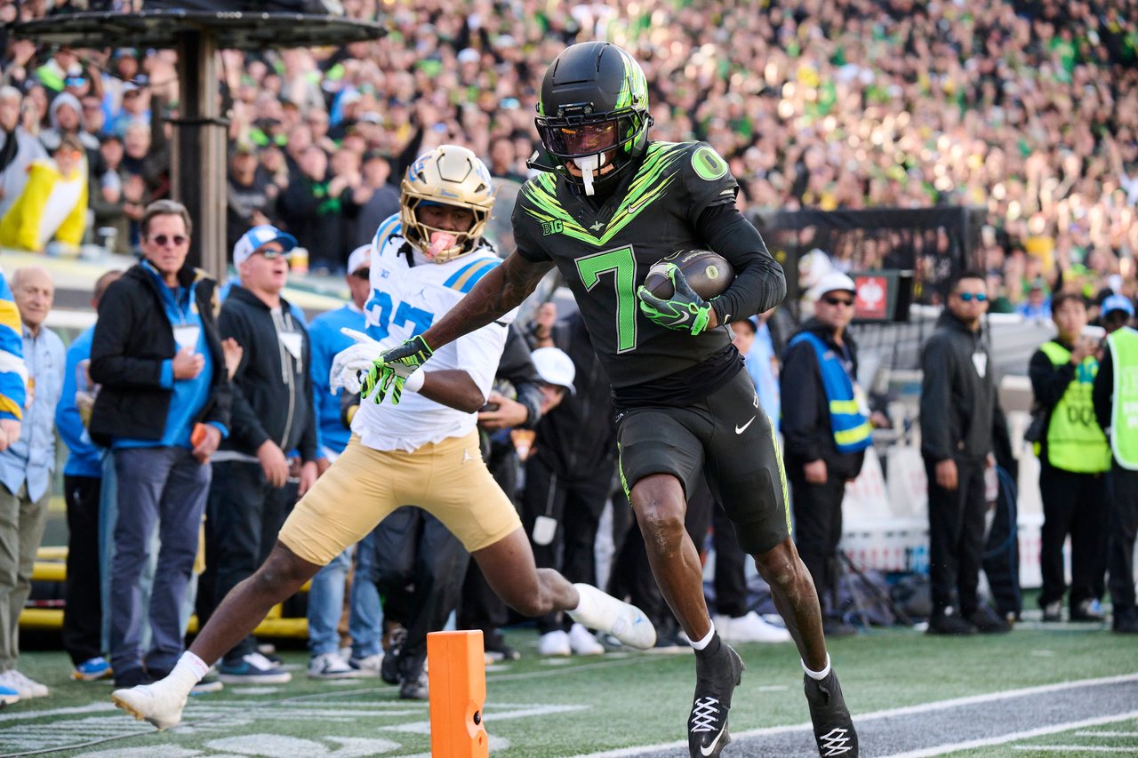 Oct 10, 2026; Eugene, Oregon, USA; Oregon Ducks wide receiver Evan Stewart (7) scores a touchdown during the second half against UCLA Bruins defensive back Ta'shawn James (27) at Autzen Stadium. Mandatory Credit: Troy Wayrynen-Imagn Images