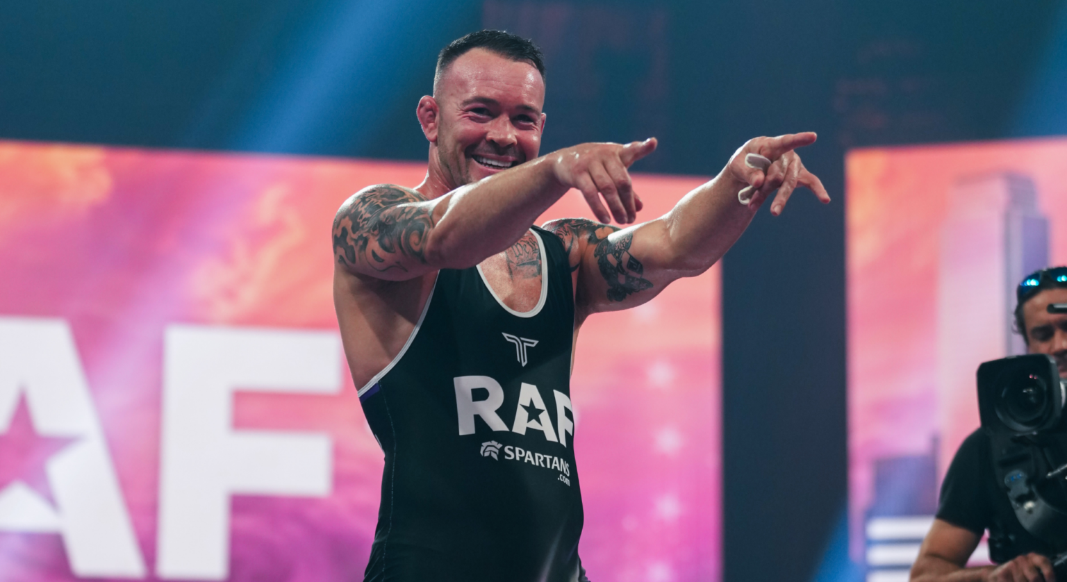 Colby Covington, in a RAF Wrestling singlet, points after winning a match