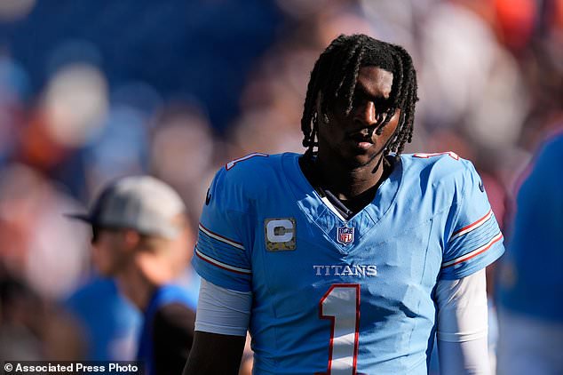 Tennessee Titans quarterback Cam Ward (1) walks off the field at the end of an NFL football game against the Cleveland Browns in Nashville, Tenn., Sunday, Oct. 25, 2026. (AP Photo/George Walker IV)