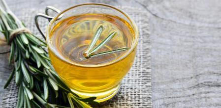 Rosemary infusion in a glass cup