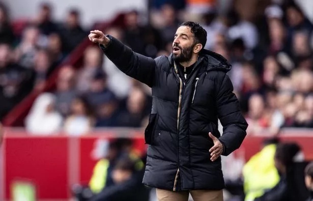 Manchester United head coach Ruben Amorim points out an instruction from the touchline.