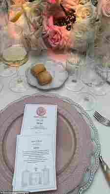 Photos show the couple treated guests to a traditional Italian meal, with a fresh pasta to start, on tables decorated with pink and white roses