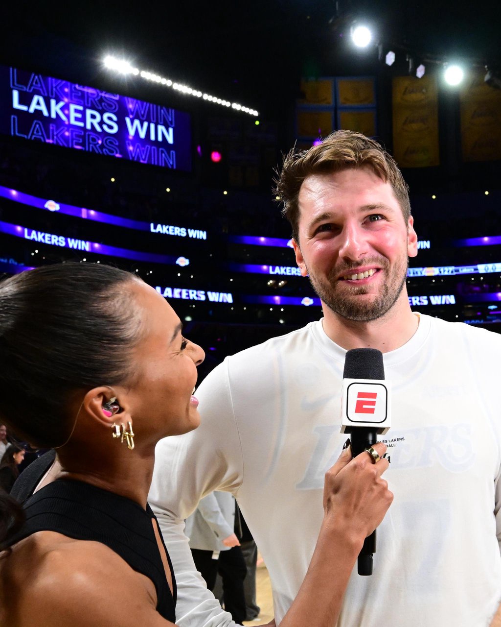 Luka Doncic #77 of the Los Angeles Lakers talks with Malika Andrews after a game against the Golden State Warriors at Crypto.Com Arena in Los Angeles on Wednesday, Oct. 21, 2026.