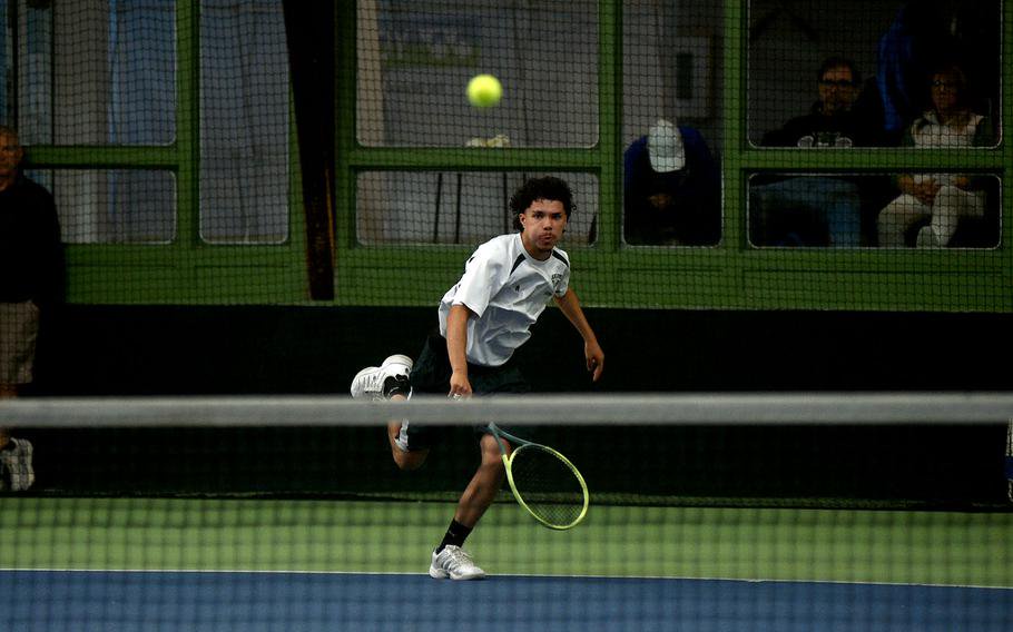 Jesus Lukas watches his serve clear the net.