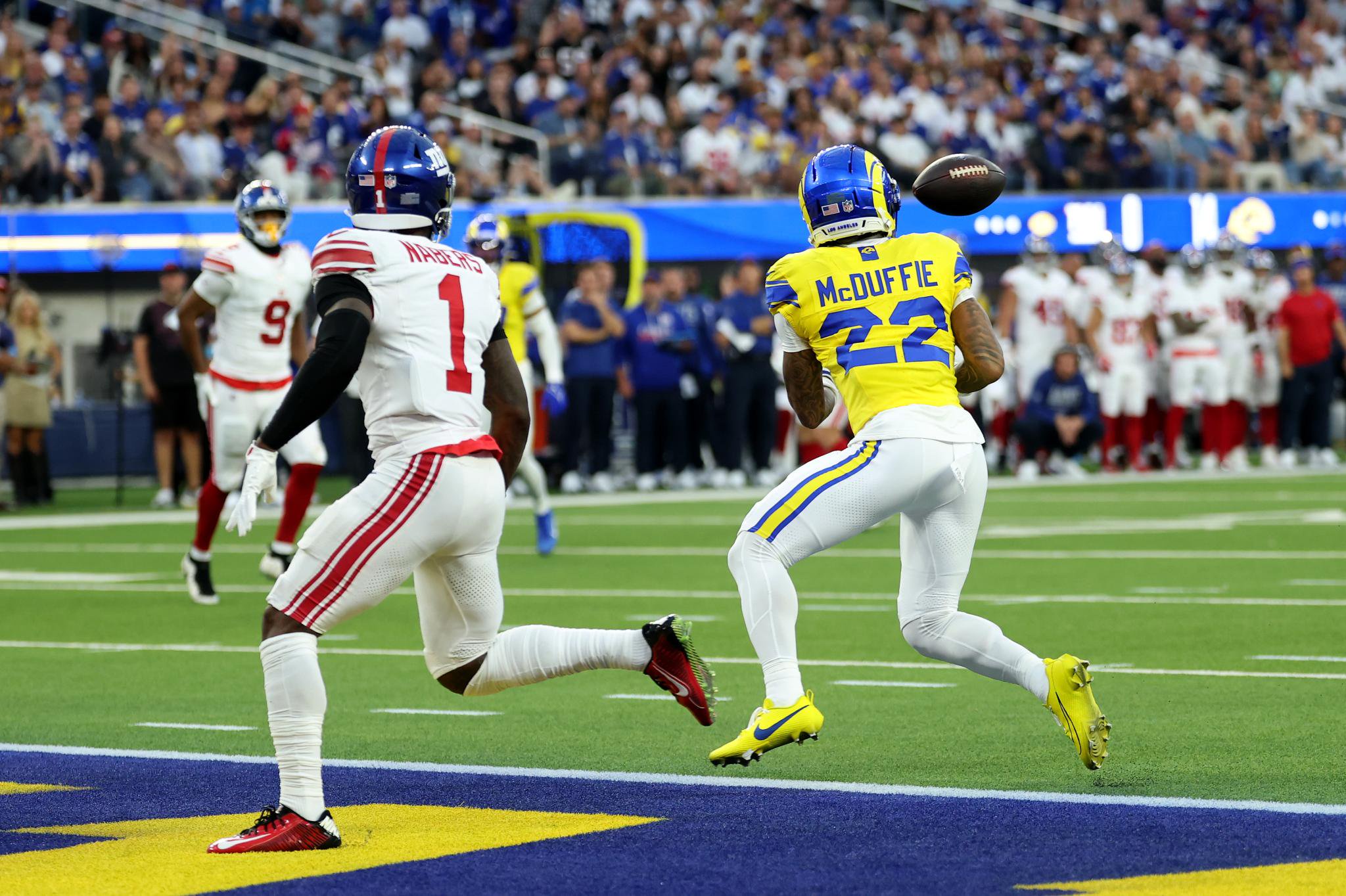 Trent McDuffie of the Los Angeles Rams intercepts a pass from Jameis Winston of the New York Giants.