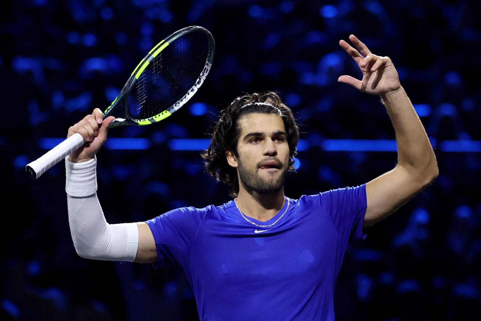 Carlos Alcaraz raises his arms at the Laver Cup.