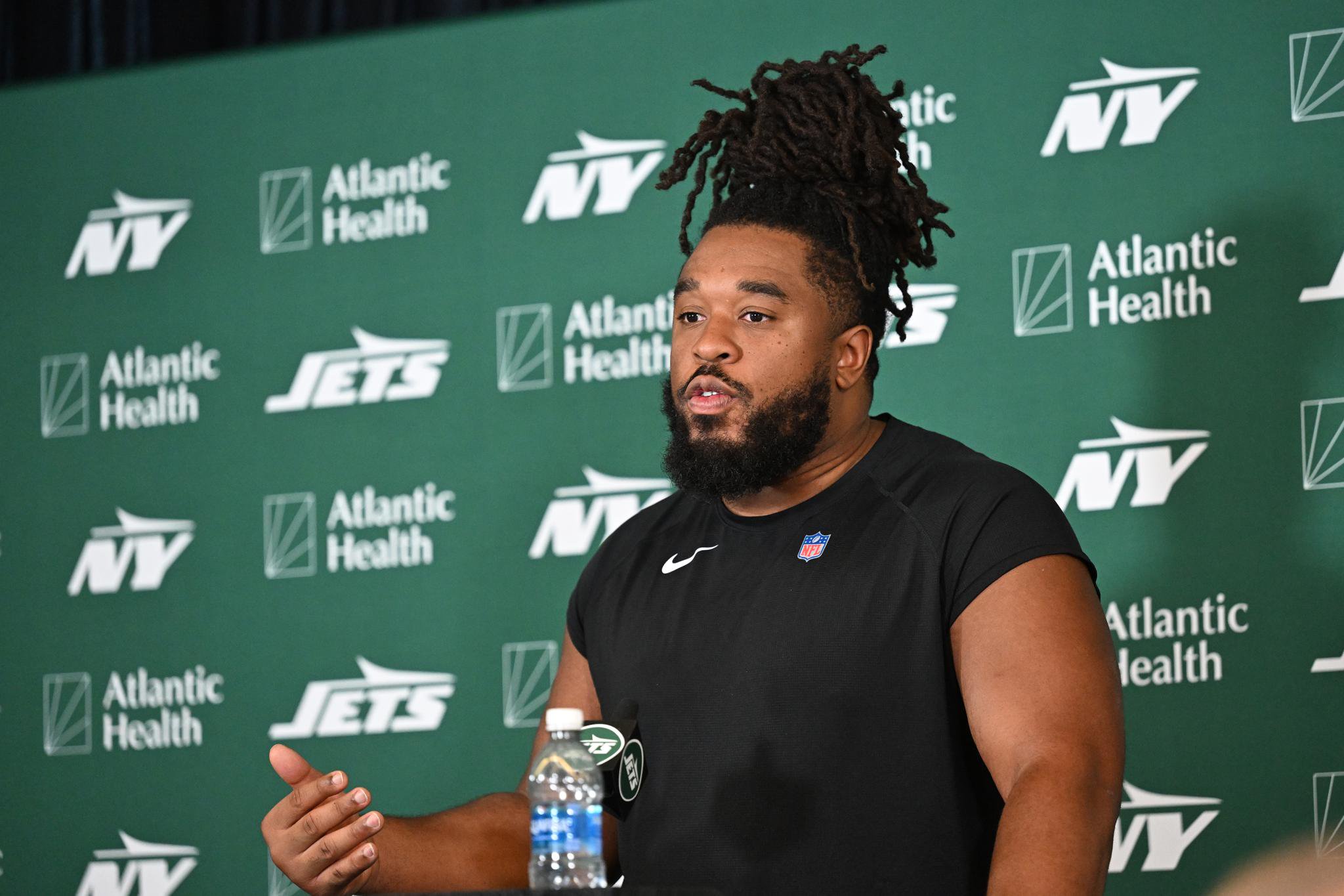 Jets offensive lineman Dylan Parham speaks to the media at training camp.