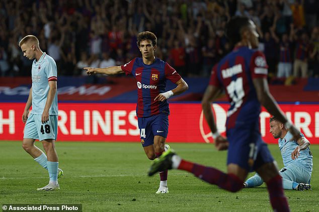 Barcelona's Joao Felix, center, celebrates after scoring his side's opening goal during the Champions League Group H soccer match between Barcelona and Royal Antwerp at the Olympic Stadium of Montjuic in Barcelona, Spain, Tuesday, Sept. 19, 2023. (AP Photo/Joan Monfort)