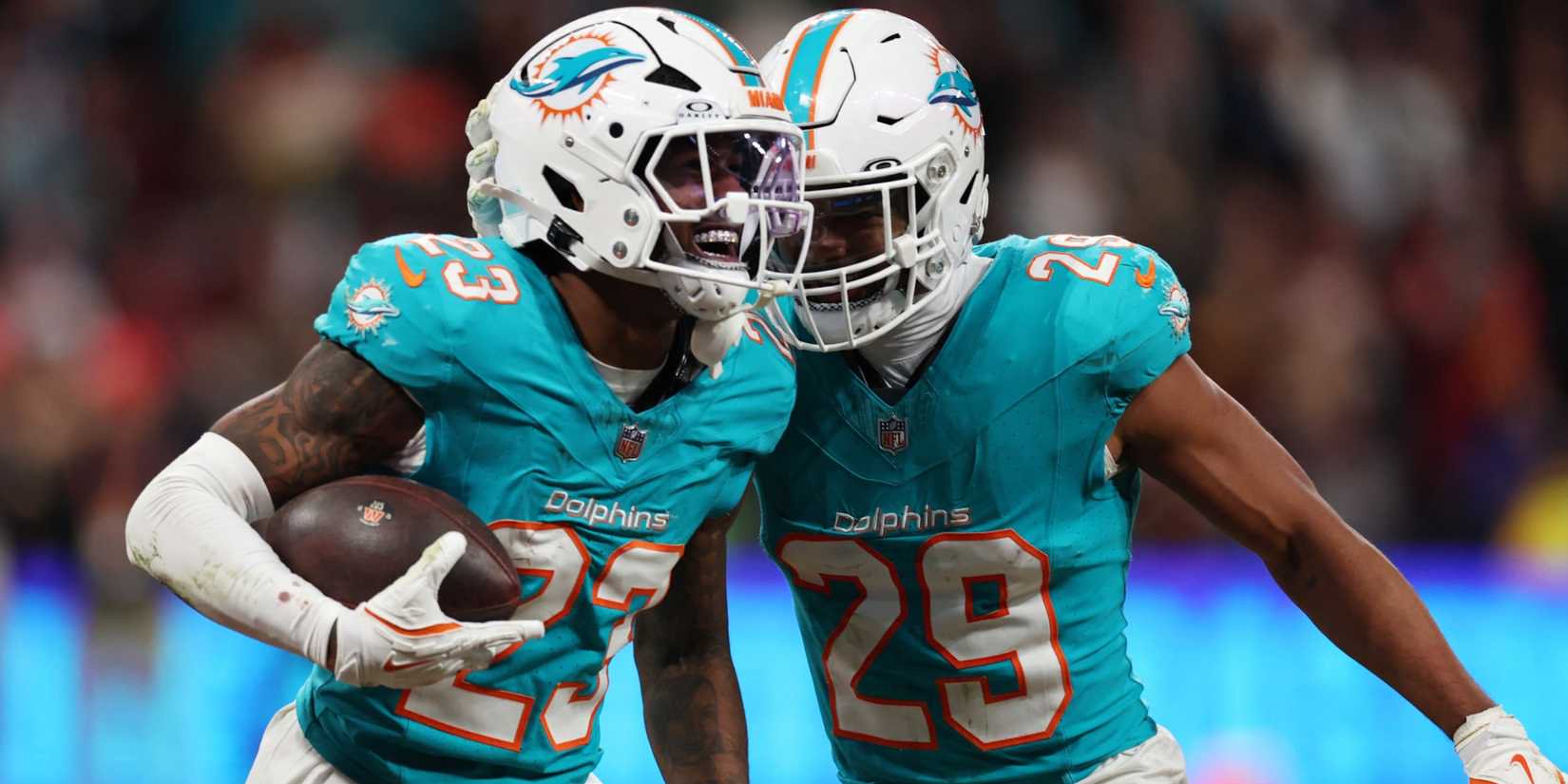 Miami Dolphins' Jack Jones and Minkah Fitzpatrick celebrate during the match