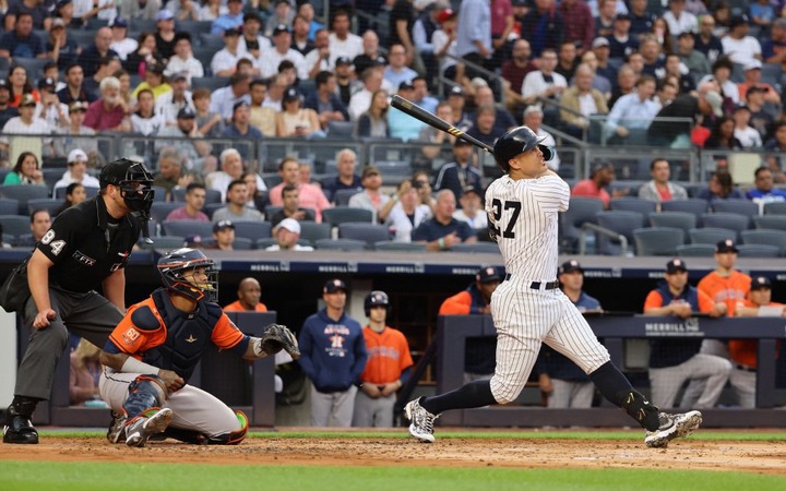Giancarlo Stanton crushes a three-run homer during the Yankees' win over the Astros. 