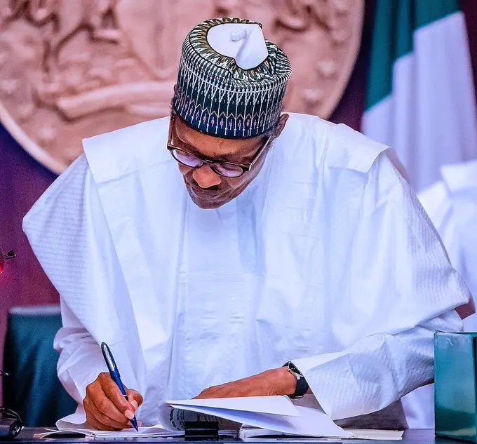 President Muhammadu Buhari signing The Nigeria Police Bill, 2020 [PHOTO: Presidency]