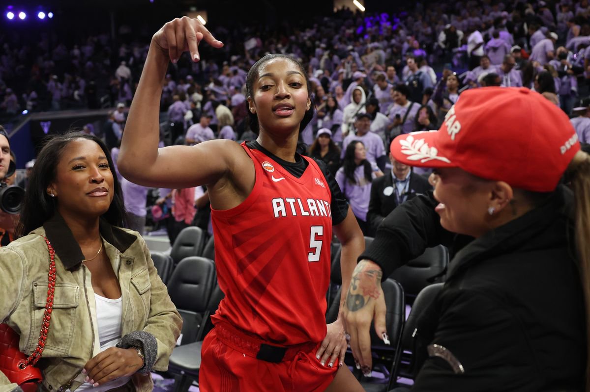 Angel Reese reacts after a Game 2 WNBA Finals win