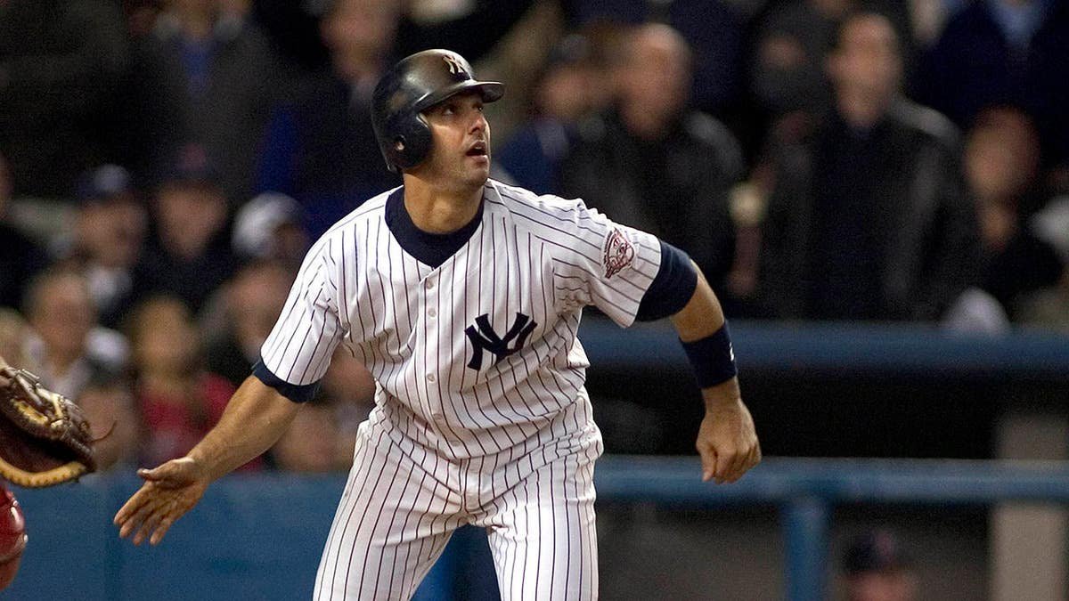 Jorge Posada stands during the Yankees' 6-5 victory over the Red Sox at Yankee Stadium.