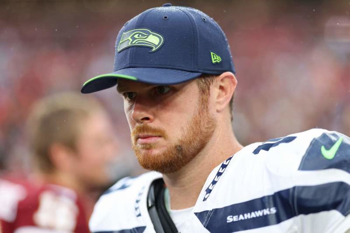 Sep 27, 2026; Landover, Maryland, USA; Seattle Seahawks quarterback Sam Darnold (14) stands on the field after the game against the Washington Commanders at Northwest Stadium. © Geoff Burke-Imagn Images