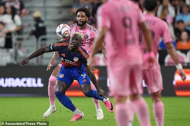 FC Cincinnati forward Kevin Denkey (9) controls the ball past Inter Miami defender Micael during the first half of an MLS soccer match, Wednesday, Oct. 28, 2026, in Miami. (AP Photo/Rebecca Blackwell)