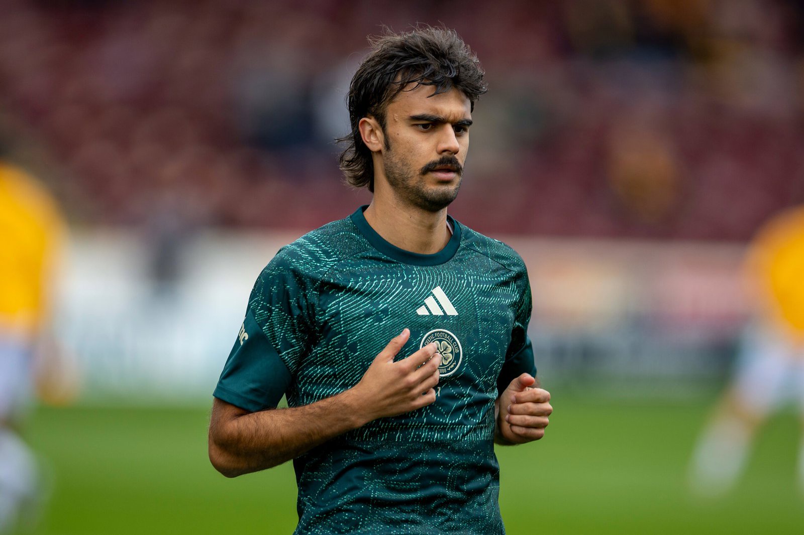 Jota of Celtic in a green training top during the warm-up at Fir Park before the Motherwell match
