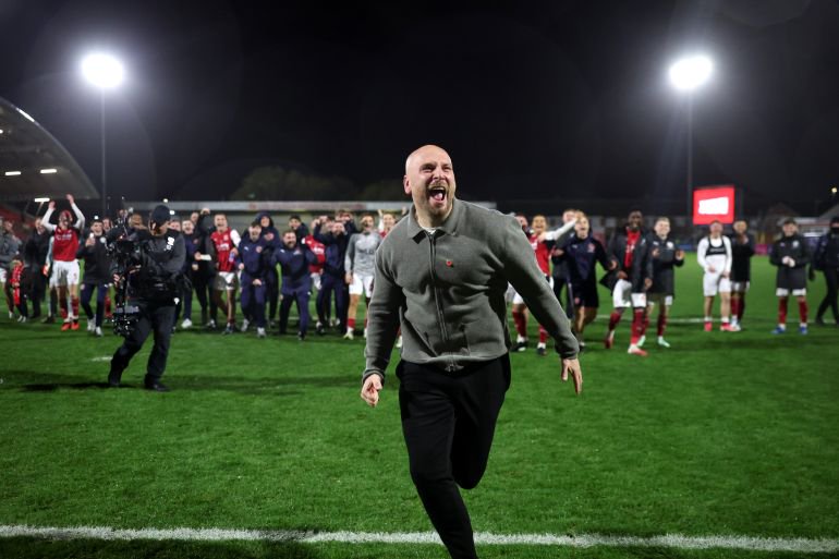 FLEETWOOD, ENGLAND - OCTOBER 27: Matt Lawlor, Manager of Fleetwood Town, celebrates after the Carabao Cup Fourth Round match between Fleetwood Town and Arsenal at Highbury Stadium on October 27, 2026 in Fleetwood, England. (Photo by Carl Recine/Getty Images)