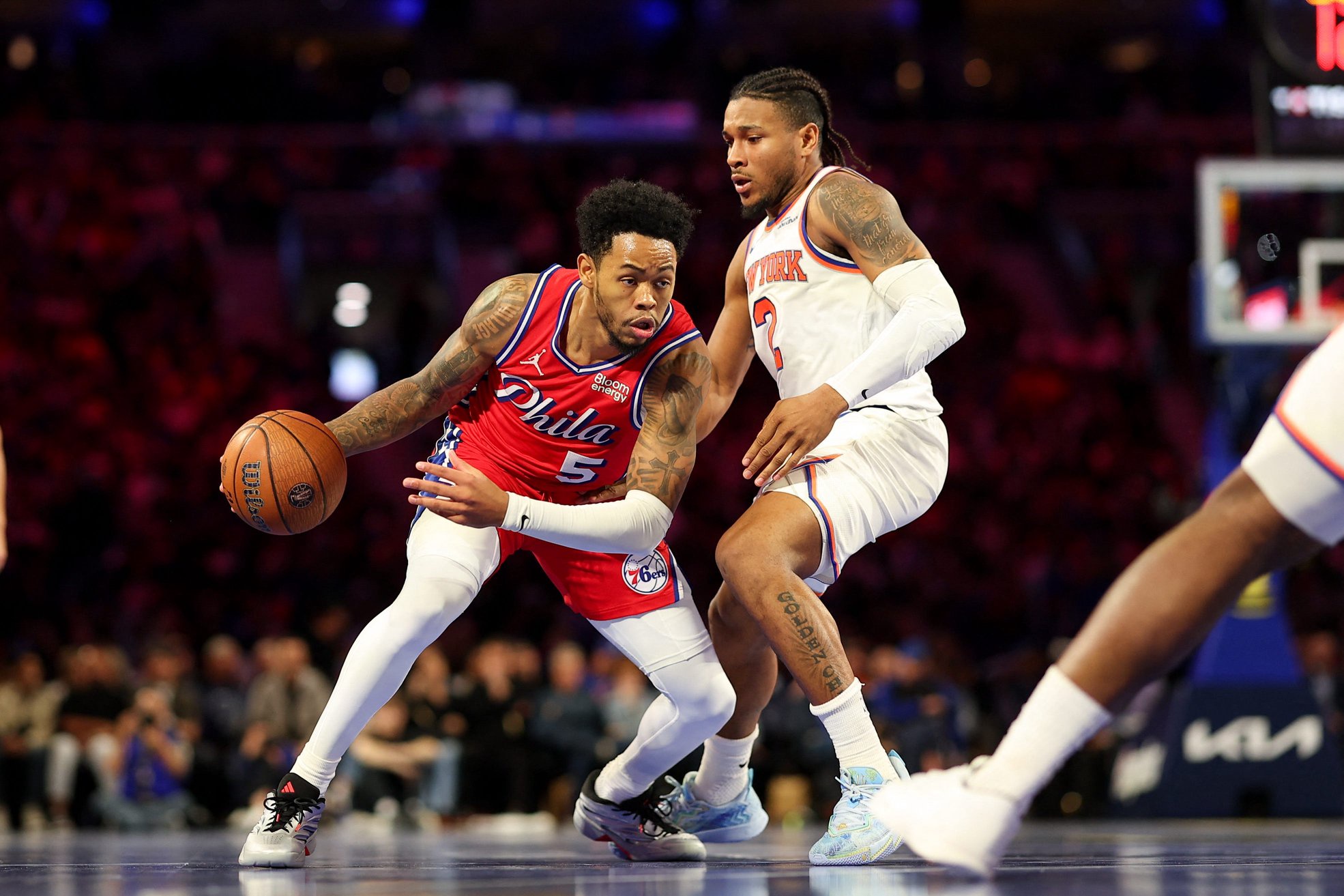 Oct 30, 2026; Philadelphia, Pennsylvania, USA; Philadelphia 76ers guard Anfernee Simons (5) drives against New York Knicks guard Miles McBride (2) during the third quarter at Xfinity Mobile Arena. Mandatory Credit: Bill Streicher-Imagn Images