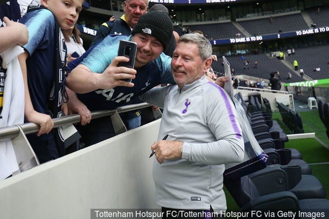 Clive Allen of Tottenham Hotspur Legends poses for a photo with a fan prior to the Spurs Legends v Inter Forever Legends match at Tottenham Hotspur Stadium on March 30, 2019 in London,...