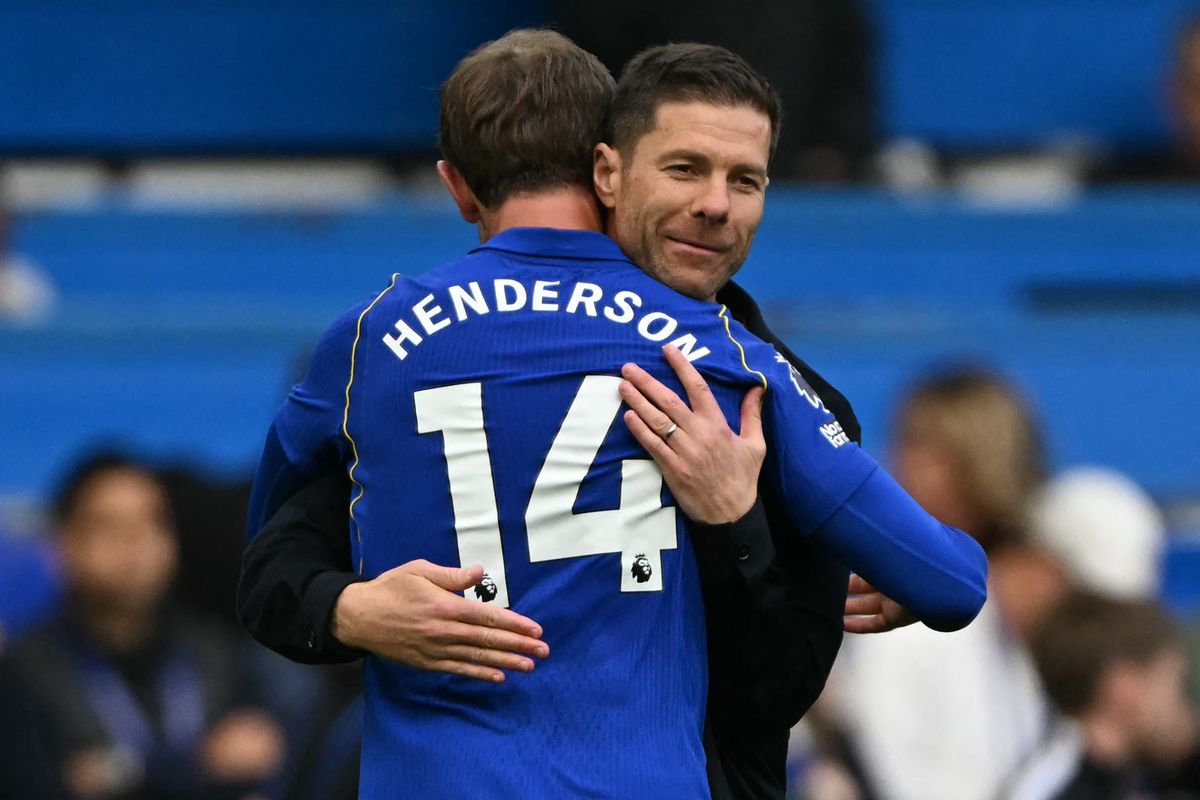 Xabi Alonso celebrates with Jordan Henderson after Chelsea's win over Bournemouth