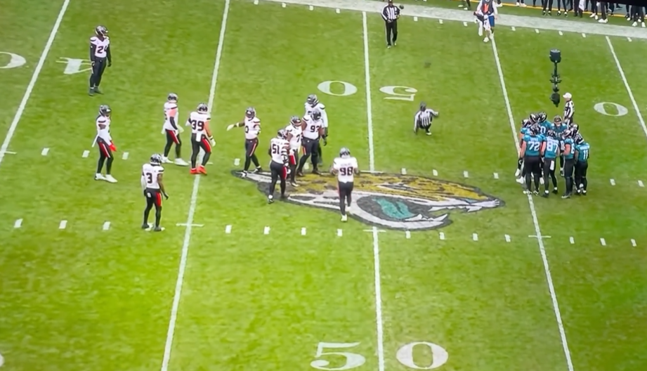 Overhead view of a football game with players on the field.