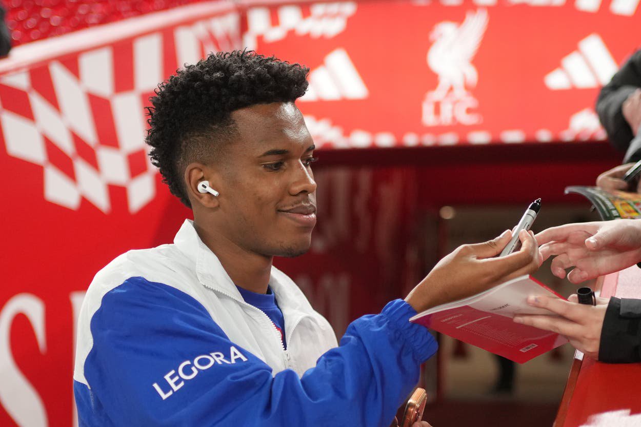 Estevao Willian signs an autograph for a fan before Liverpool vs Chelsea