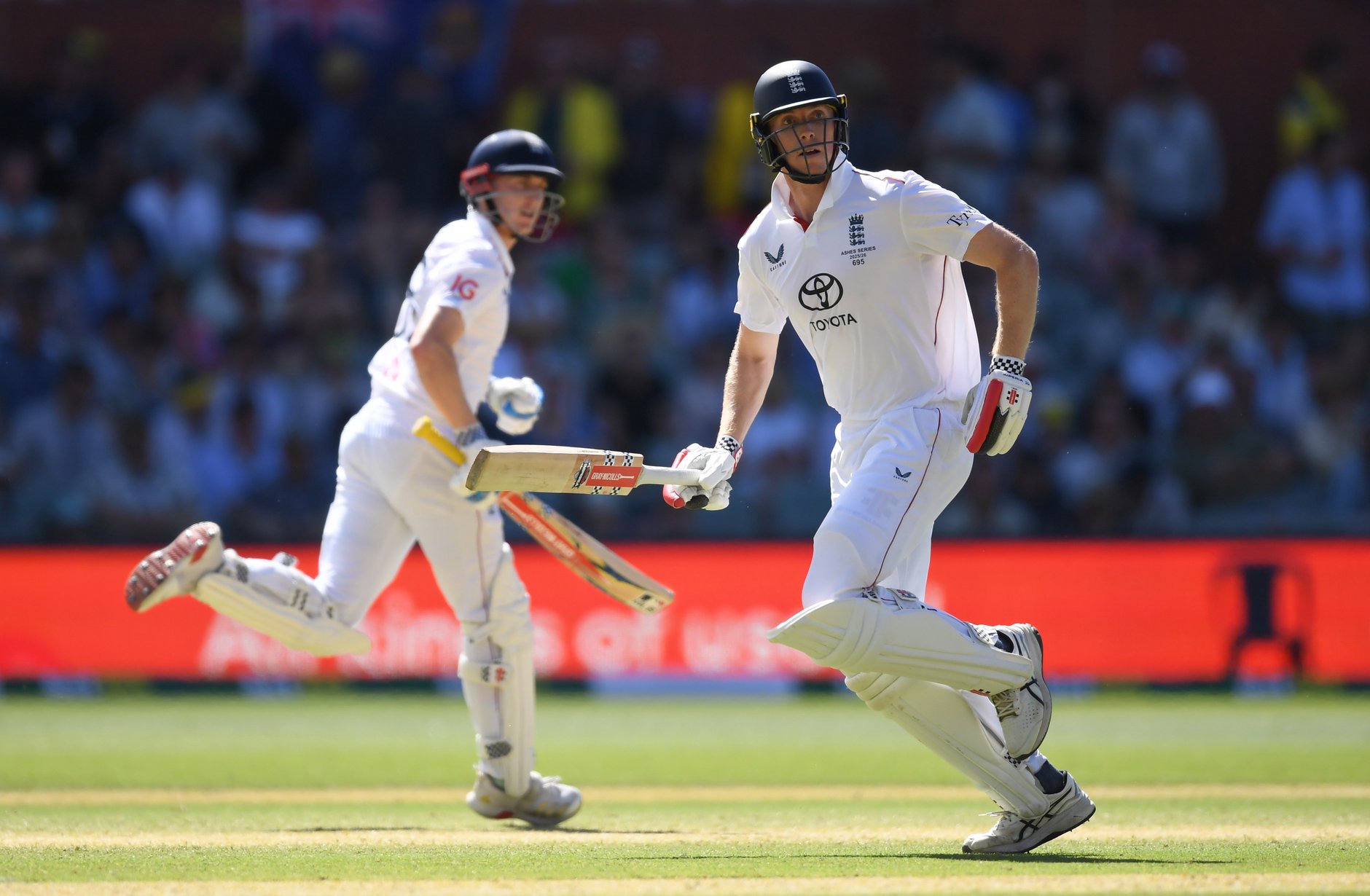 Zak Crawley (R) and Harry Brook of England run during day four of the Third Test Match in the 2025-26 Ashes Series between Australia and England at Adelaide Oval 