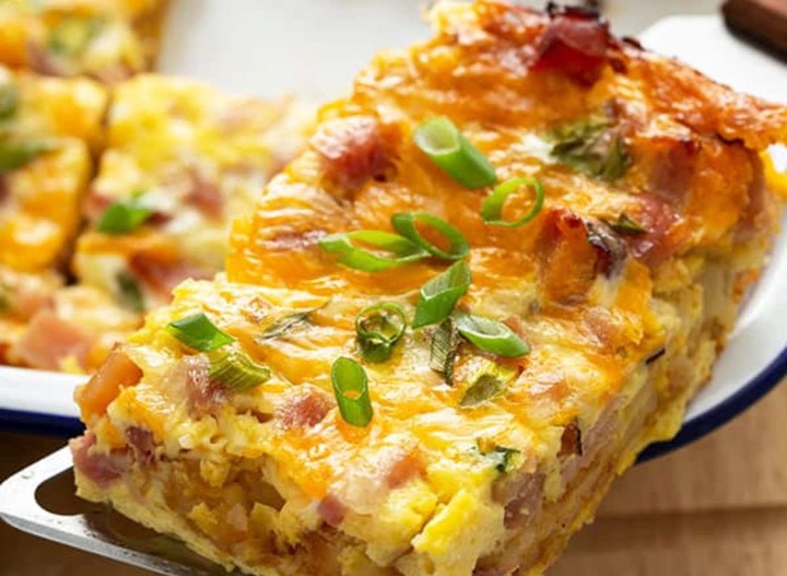 Slide 8 of 14: If you're looking for a recipe to feed a crowd in the morning, this Hash Brown Egg Casserole is an easy go-to. Layered with hash brown patties, cheese, eggs, and ham, this savory casserole dish will certainly be a crowd-pleaser for all.Get the recipe at Bellyfull.