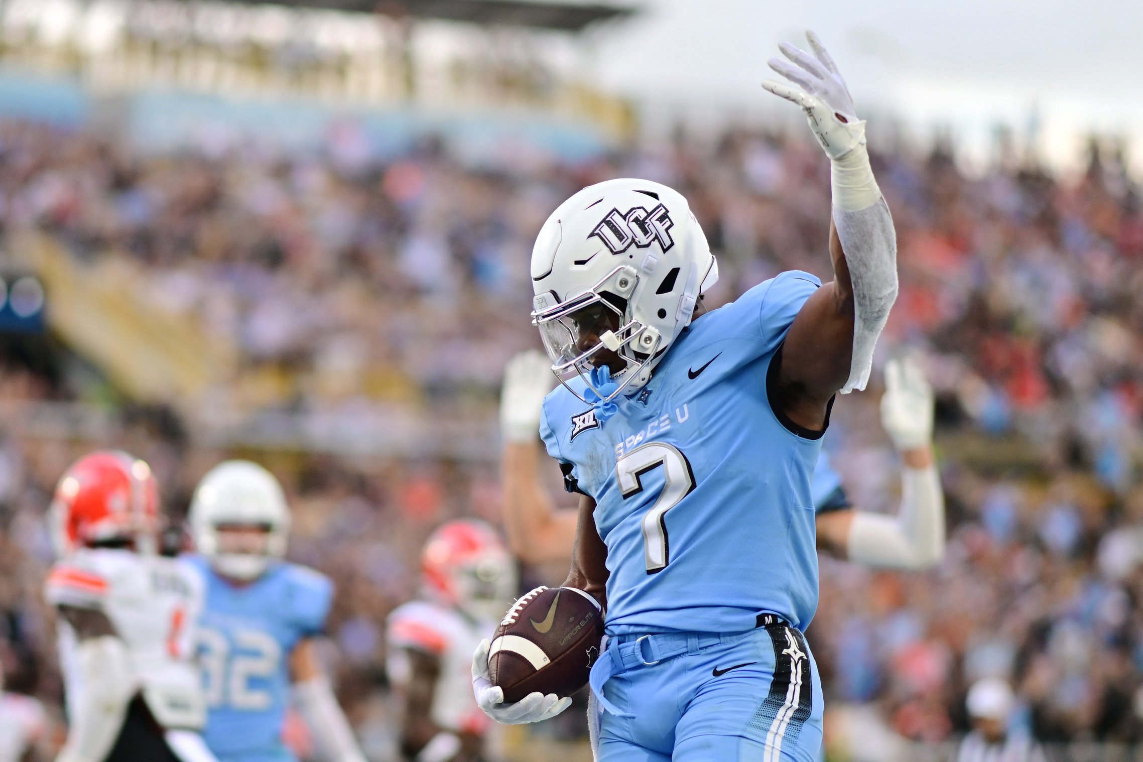 ORLANDO, FLORIDA - NOVEMBER 11: RJ Harvey #7 of the UCF Knights reacts after scoring a touchdown in the first quarter against the Oklahoma State Cowboys at FBC Mortgage Stadium on November 11, 2023 in Orlando, Florida. (Photo by Julio Aguilar/Getty Images)