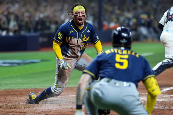 William Contreras #24 of the Milwaukee Brewers reacts after scoring.
