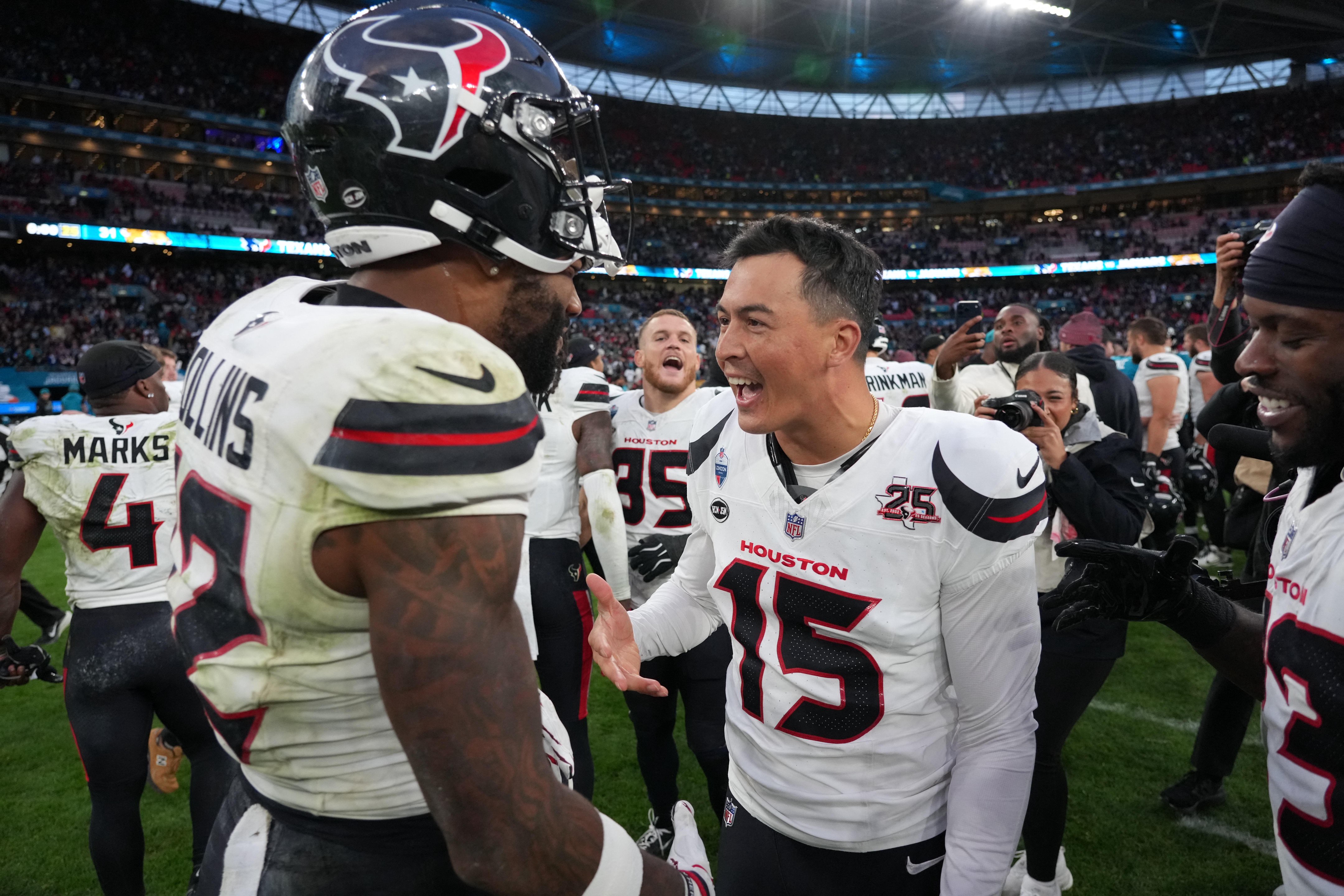 Oct 18, 2026; London, United Kingdom; Houston Texans place kicker Ka'imi Fairbairn (15) celebrates with wide receiver Nico Collins (12) after kicking the winning field as time expired against the Jacksonville Jaguars during the 2026 NFL London Games at Wembley Stadium. Mandatory Credit: Kirby Lee-Imagn Images