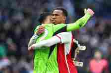 Gabriel Magalhaes of Arsenal celebrates victory with Arsenal goalkeeper David Raya during the Premier League match between Tottenham Hotspur and Ar...
