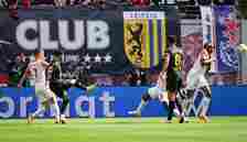 Jadon Sancho of Borussia Dortmund scores his team's first goal during the Bundesliga match between RB Leipzig and Borussia Dortmund at Red Bull Are...