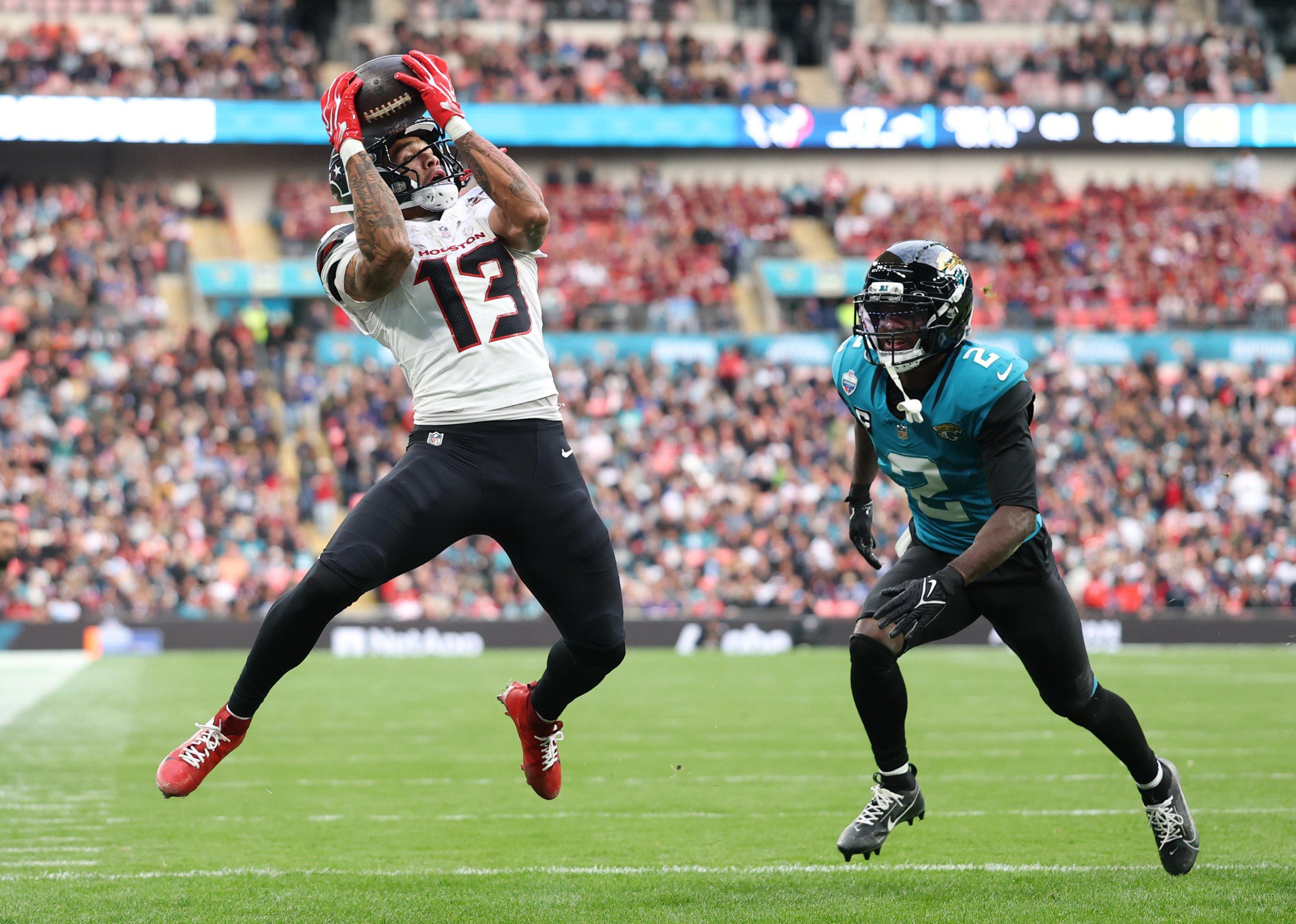 LONDON, ENGLAND - OCTOBER 18: Jaylin Noel of the Houston Texans catches the ball whilst under pressure from Jourdan Lewis of the Jacksonville Jaguars during the NFL London Series match between Houston Texans and Jacksonville Jaguars at Wembley Stadium on October 18, 2026 in London, England. (Photo by Julian Finney/Getty Images)