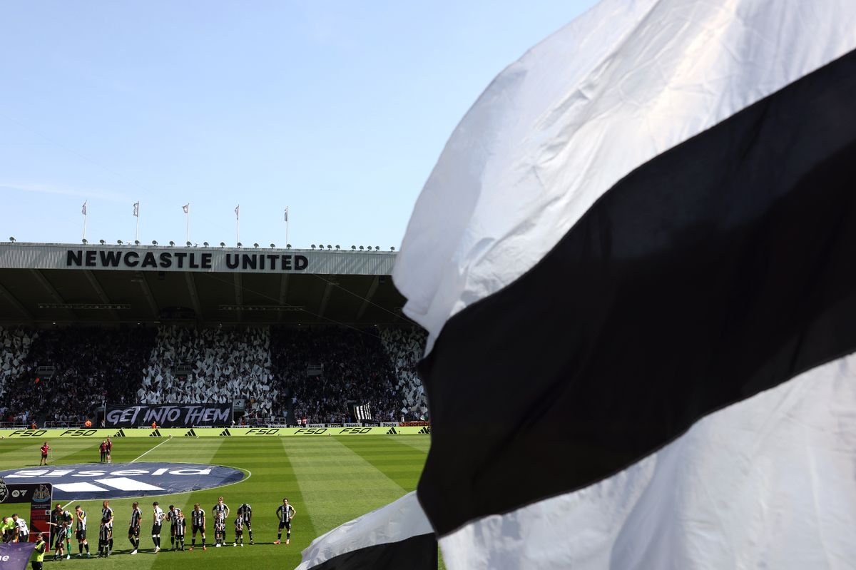 Newcastle United fans wave flags and show support as the teams line up prior to the Premier League match between Newcastle United FC and Chelsea FC at St James' Park.