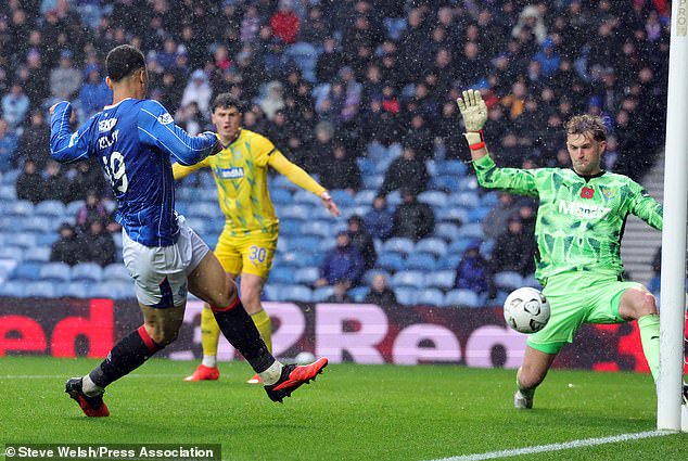 Striker Kevin Kelsy scores Rangers' third goal against St Johnstone