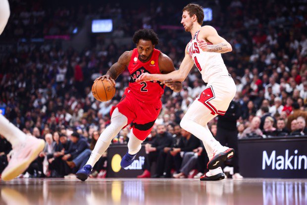 Kawhi Leonard of the Toronto Raptors drives against Matas Buzelis of the Chicago Bulls in the first half at Scotiabank Arena on Oct. 21, 2026, in Toronto, Canada. (Cole Burston/Getty Images)