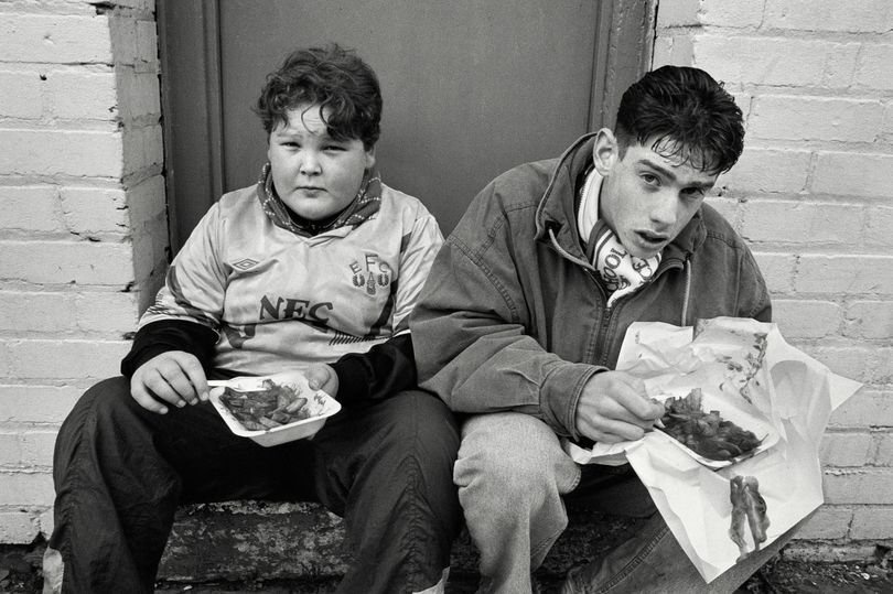 Everton Fans enjoying their chips and gravy at Goodison Park, 1991
