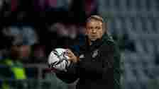 Hansi Flick, Head Coach, of Germany throws a ball during the 2022 FIFA World Cup Qualifier match between Iceland and Germany at  on September 08, 2...