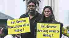 Newly-elected TMC MLAs Sayantika Bandyopadhyay and Rayat Hossain Sarkar wearing black attire protest as they wait on the premises of West Bengal Legislative Assembly for their swering-in ceremony, in Calcutta, Tuesday, July 2, 2024.