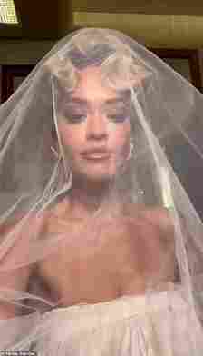 Glam! Rita revealed she wore three different Tom Ford looks for her big day (pictured in a wedding dress for her You Only Love Me music video)