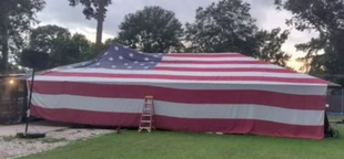 Louisiana family drapes home with 50-foot American flag to celebrate Independence Day