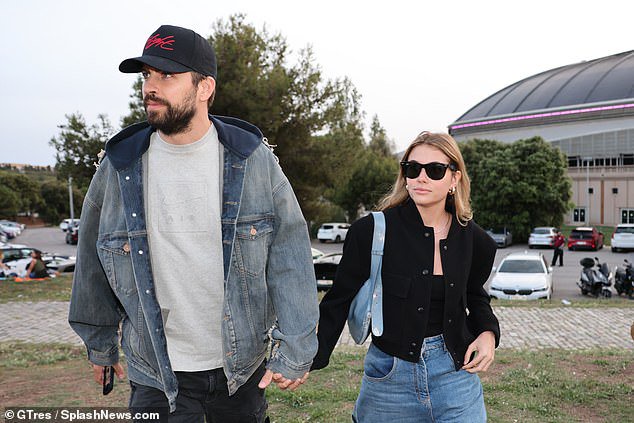 Chic: Sartorially in sync with the athlete, Clara, 24, also opted for denim in the form of wide legged jeans that she paired with a black vest and cardigan