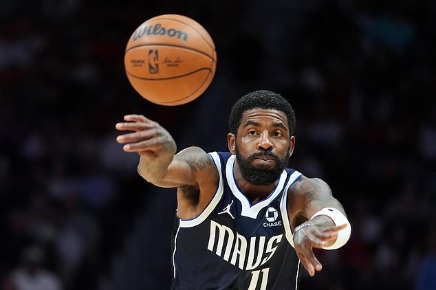 Dallas Mavericks guard Kyrie Irving (11) passes the ball during the first half of an NBA basketball game against the Miami Heat, Monday, Oct. 26, 2026, in Miami. (AP Photo/Rebecca Blackwell)