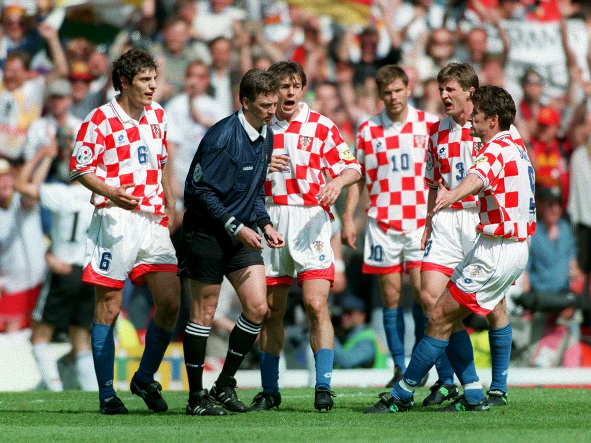 Slaven Bilic, Davor Suker and Robert Jarni of Croatia appeal to referee Leif Sundell during the Euro 1996 quarter final match between Germany and Croatia at Old Trafford in June 1996